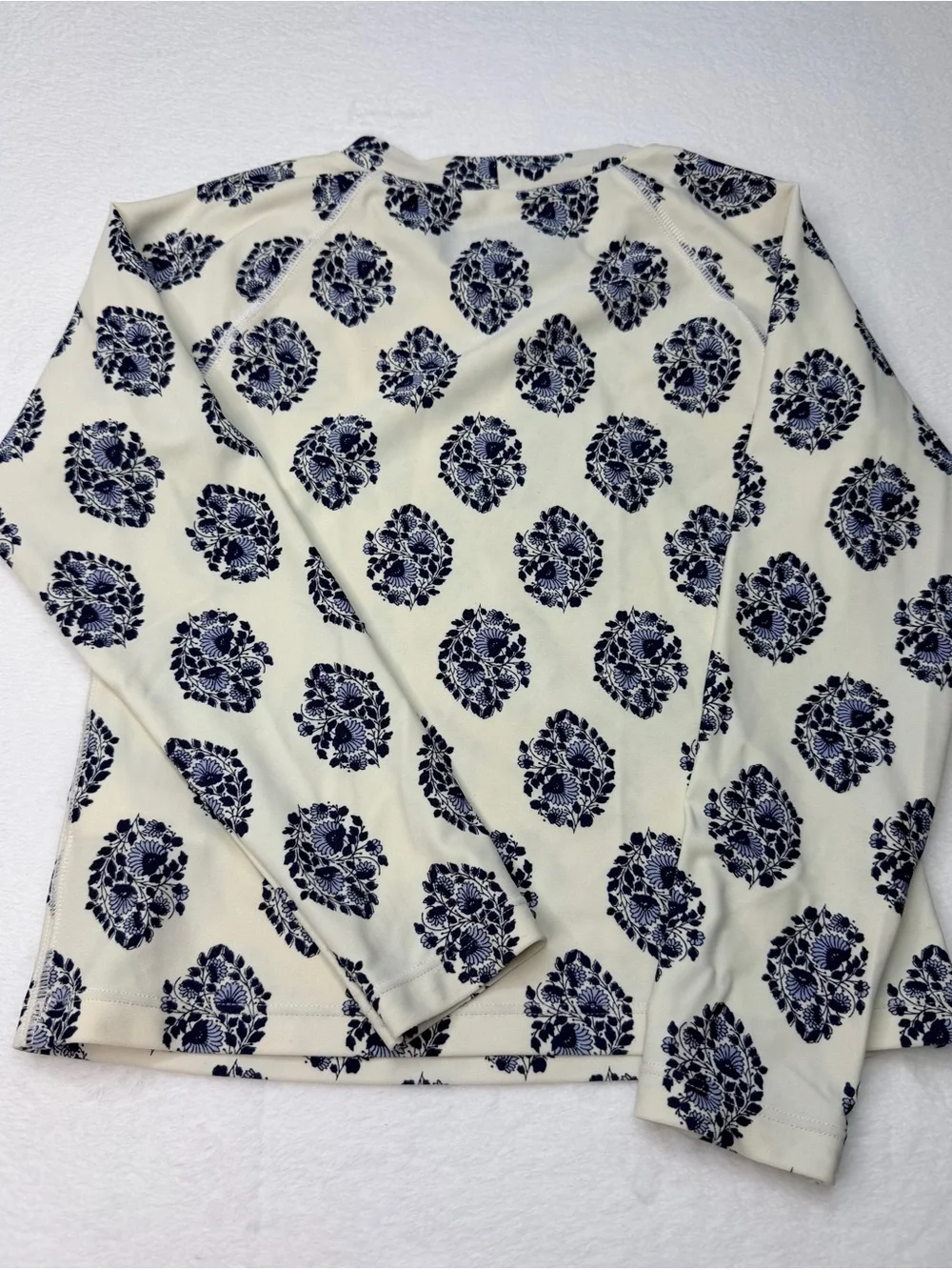 J.Crew long-sleeve rash guard featuring an all-over navy and white floral 6-7